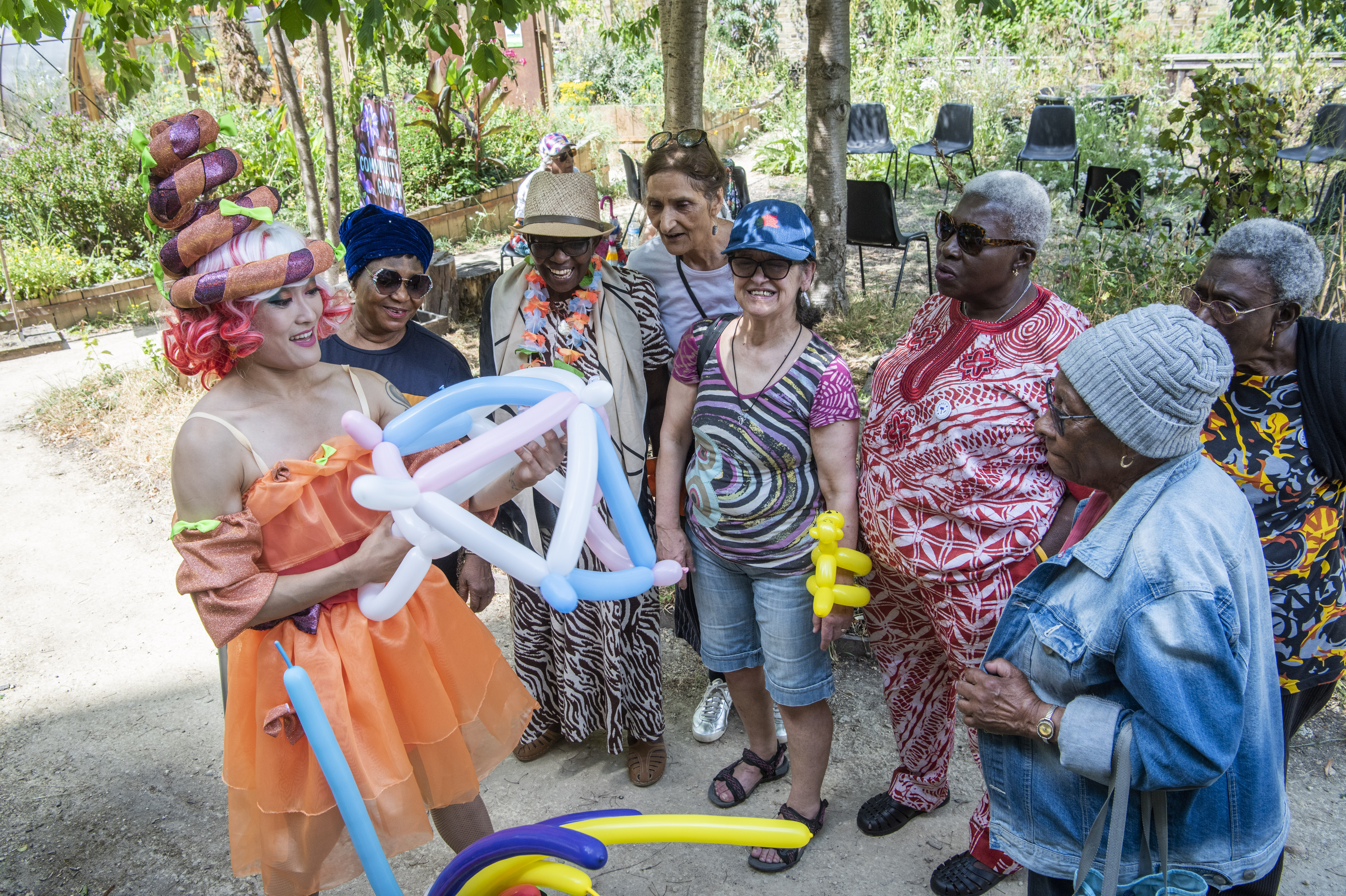 Brainfools performers in costume engaging a live audience outdoors
